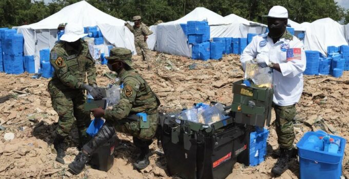 A Person Stocking Up On High-Quality Mres During A Peacekeeping Or Disaster Response.